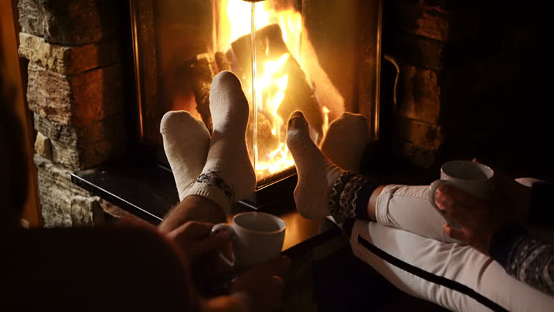  couple at winter fire place